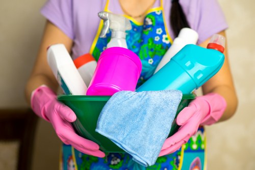 Cleaning staff maintaining a Putney office kitchen and communal surfaces