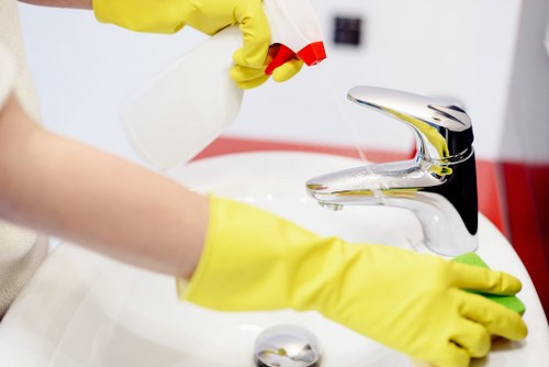 Local technician treating a stain on a sofa in Putney