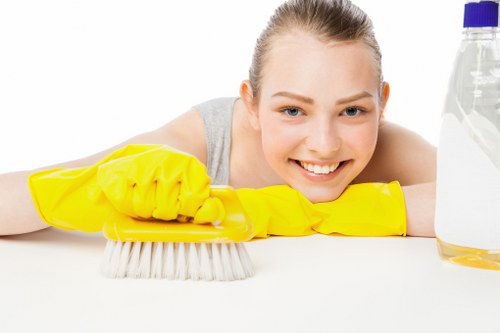 Local oven cleaner working in a Putney apartment kitchen