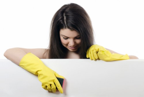 House cleaner vacuuming stairs in a Putney townhouse
